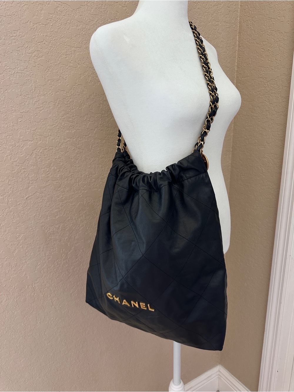 CHANEL Black Quilted Leather  with Gold-Tone Chain Strap 22 bag (Large)